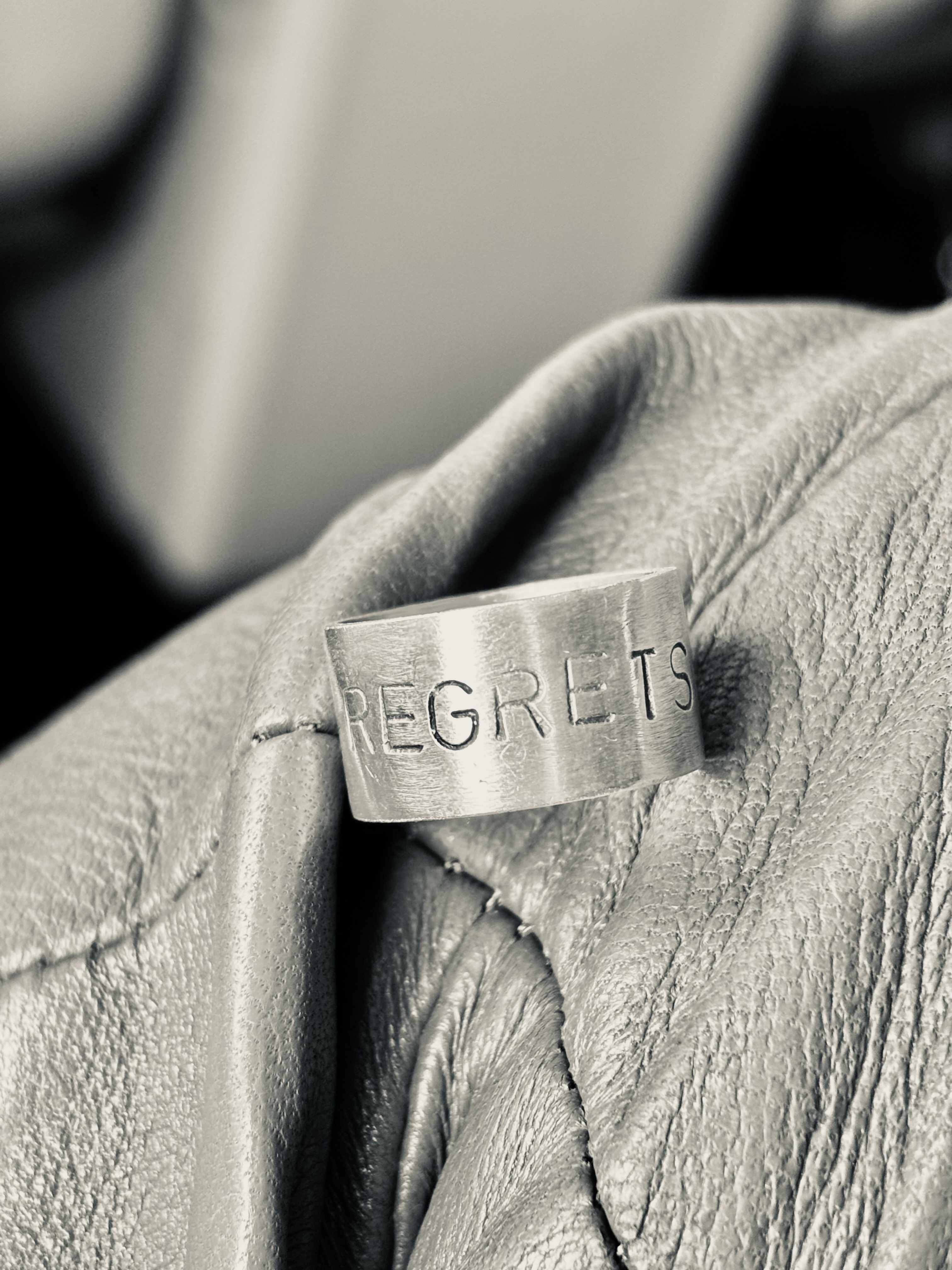 Silver, oxidised letters