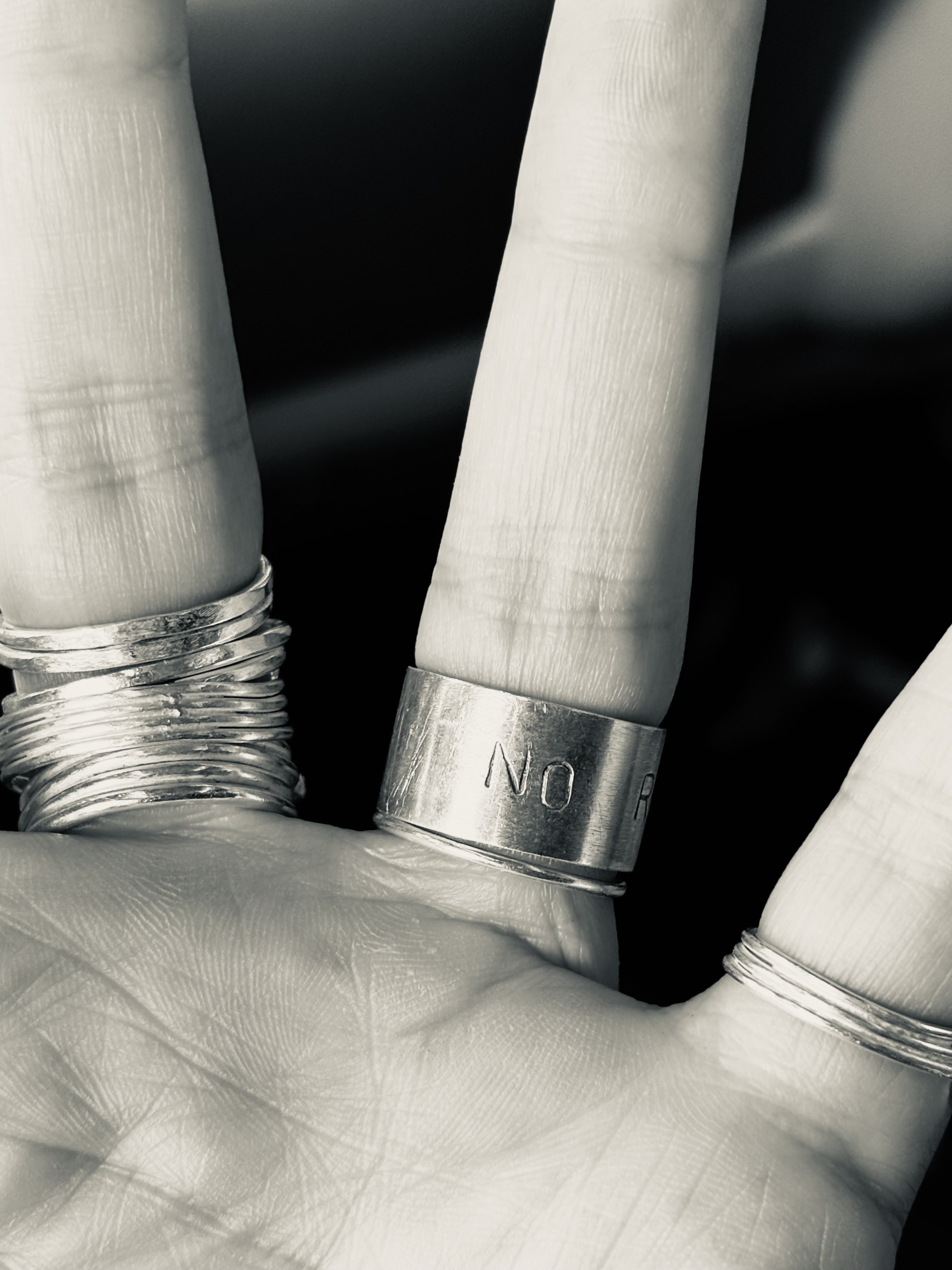 Silver, oxidised letters